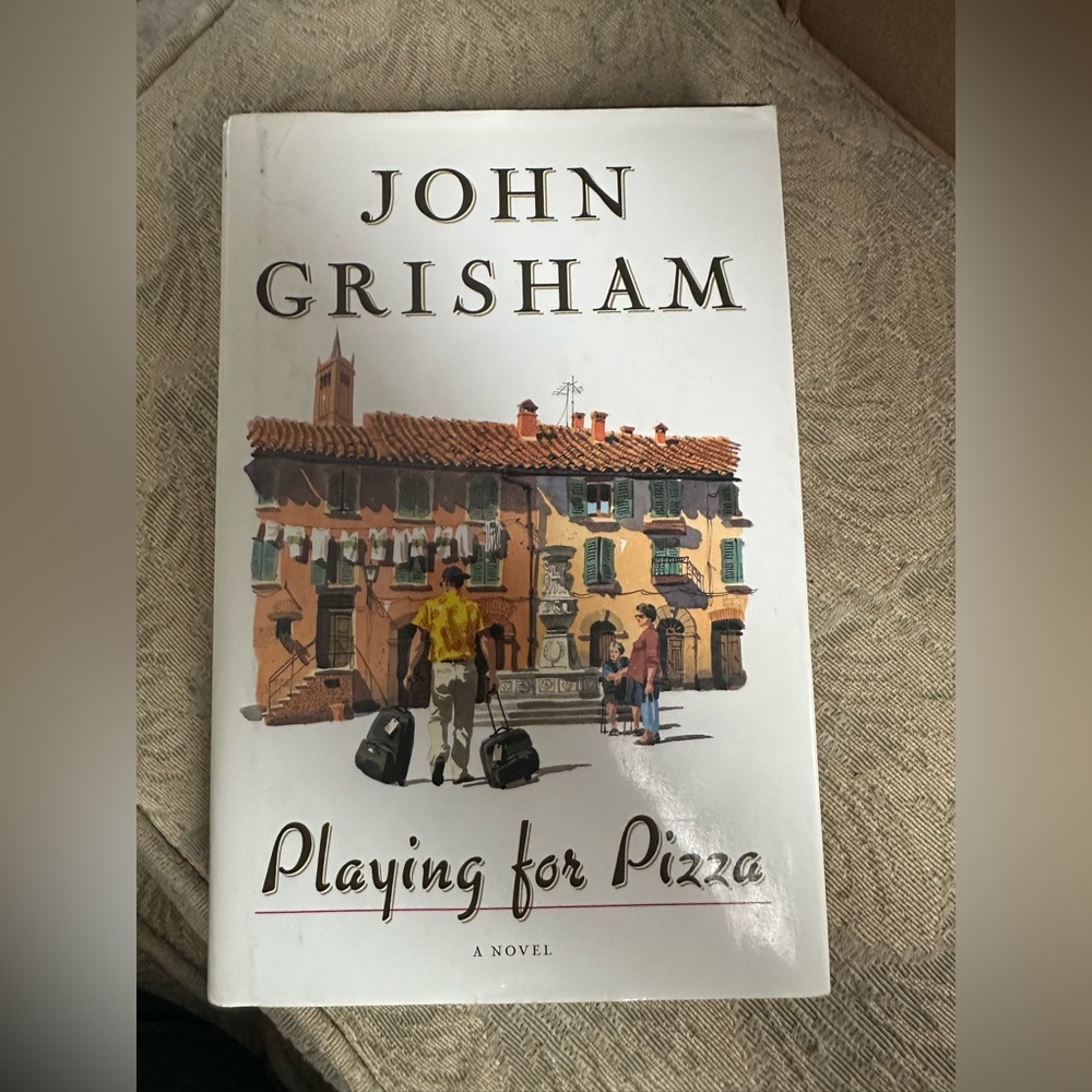 Playing for Pizza by - White Paperback Novel